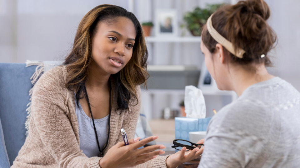 guidance counselor talking to a student