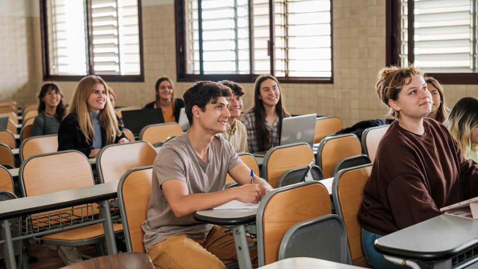 students sitting and listening in a community college classroom