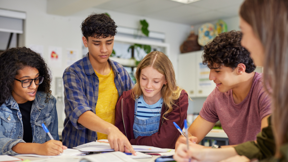 four students working on a project together