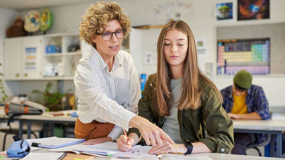 a female teacher with a student