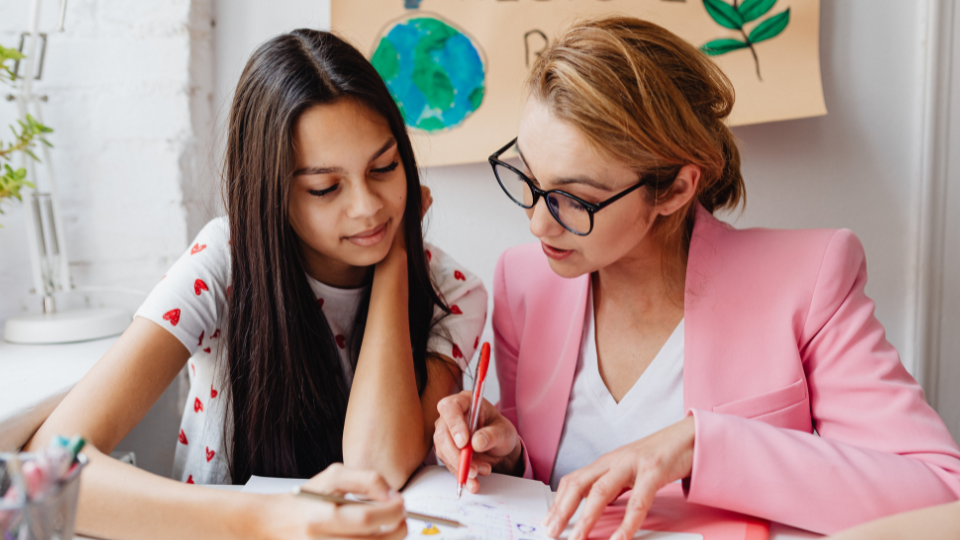 a teacher tutoring a teenager